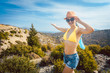 © Kzenon - Woman tourist in front of southern European landscape in her vacation