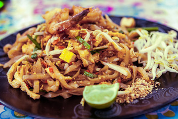 Wall Mural - Pad Thai plate at a street food stall at the weekend market, Phuket, Thailand