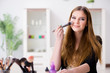 © Elnur - Young woman applying make-up preparing for party