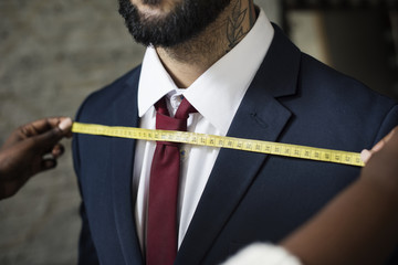 Wall Mural - Classy man in the tailor shop