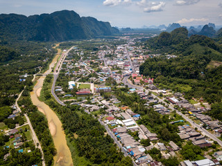 Wall Mural - Aerial view of the small Thai town of Phang Nga surrounded by jungle and mountains