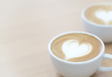 Closeup Latte Art Coffee With Heart Shape In White Cup For Relax Time And Holiday Concept, Selective And Soft Focus