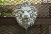 Lion Head Sculptures Spray Water In Garden. Lion Head Sculptures For Decoration In Garden.