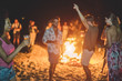 © DisobeyArt - Happy friends drinking beer at beach music festival
