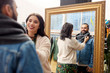 © Syda Productions - sale, shopping, fashion and people concept - couple choosing clothes at vintage clothing store