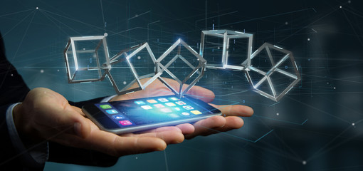 Poster - Businessman holding a 3d rendering blockchain cube isolated on a background