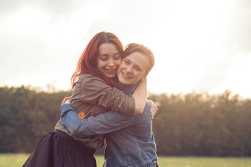 two friends having good time outdoors