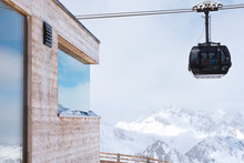 Cable Car At A Ski Resort. The Movement Of The Black Cabin