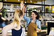 © Rawpixel.com - Women give a high five to each other