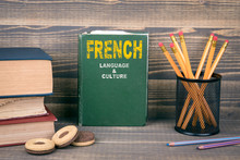 French Language And Culture Concept. Book On A Wooden Background