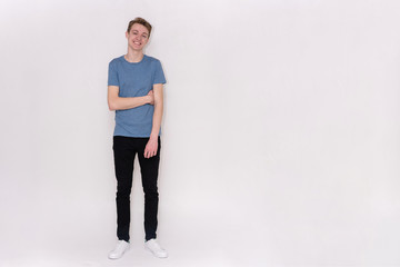 young man on a white background in different poses showing different emotions