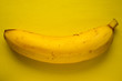 yellow banana on a yellow paper background