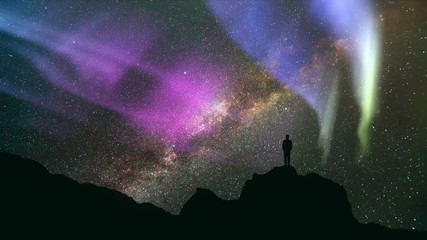 Wall Mural - The man standing on the rock against the northern light. time lapse
