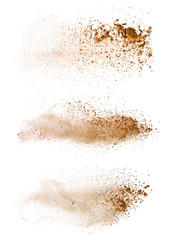 Wall Mural - Abstract colored brown powder explosion isolated on white background.