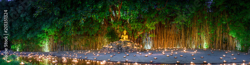 Fotomural monks sitting meditate with many candle in Thai temple at night , Chiangmai ,Tha