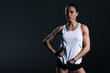 © LIGHTFIELD STUDIOS - attractive female bodybuilder posing in sportswear, isolated on grey