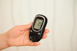 © nagaets - glucometer with result of measurement sugar level and tape measure, concept of diabetes