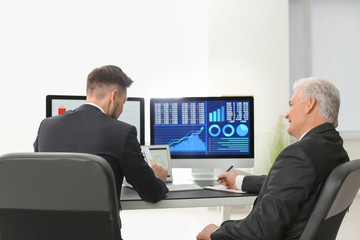 Poster - Male brokers working in office. Finance trading concept