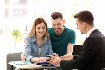 Young couple meeting with consultant in office