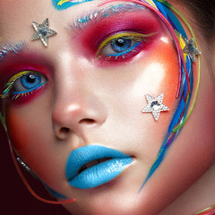 Beautiful girl with creative make-up in pop art style. Beauty face. Photo taken in studio