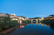 Panoramic cityscape of Toledo with San Martin's Bridge at night near Madrid, Spain