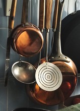 Close Up Of Utensils Hanging In Kitchen