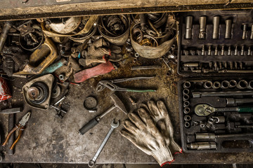 Wall Mural - Workshop scene. Old tools in workshop, Tool shelf against a table and wall, vintage garage style. DIY and home improvement banner with work and construction tools on a metal workbench top view.