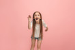 © master1305 - Beautiful female half-length portrait on pink studio backgroud. The young emotional teen girl