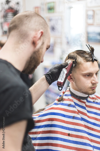Men S Haircut In Barbershop Master Barber Does A Haircut To The