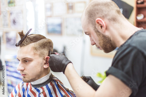 Men S Haircut In Barbershop Master Barber Does A Haircut To The