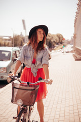 Wall Mural - Woman with bike on the street