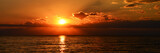 Fototapeta Zachód słońca - beutiful orange sunset on the calm sea
