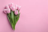 Fototapeta Tulipany - Beautiful tulips for Mother's Day on color background, top view