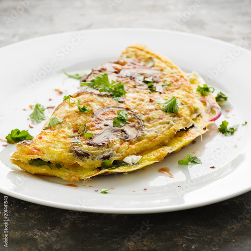 Omelett mit Pilzen - Omelette with mushrooms – Stock-Foto | Adobe Stock