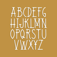 Vector capital font in Art Deco style on a gold background.