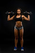 © ladie_c - Perfect Fitness Body of Beautiful Woman. Fitness Instructor in Sports Clothing. Female Model with Fit Muscular and Slim Body in Sportswear doing Workout. Fit Lady Lifting Dumbbells.