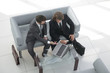© ASDF - business colleagues discussing data from the laptop.