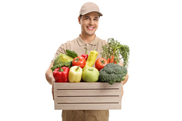 Wall Mural - Delivery guy giving a crate filled with groceries