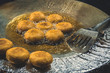 Potato pancakes fried in boiling oil.