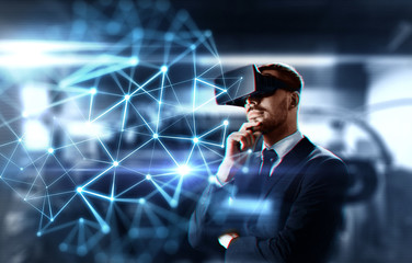 business, network and future technology concept - businessman in virtual reality headset with low poly shape projection over abstract background