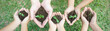 © paulaphoto - Children hands holding sapling in soil surface plant, spring or summer time, Multicultural hands of children and adult with plant, Green environment cultivate and sustain earth day concept banner