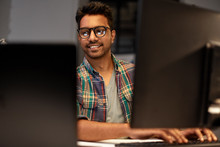 Deadline, Technology And People Concept - Close Up Of Creative Man In Glasses Working At Night Office And Thinking