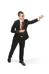 Above portrait of a businessman with very serious face. Confident professional with piercing look in the foreground of the camera.