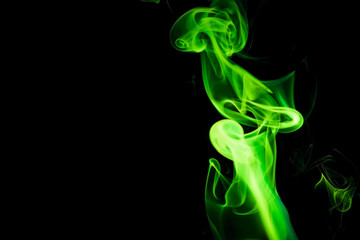 Green smoke on black background