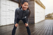 © Flamingo Images - Active young Asian woman taking a break from jogging