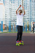 © Natali - cute young sport boy skating on yellow skateboard and has a good time on his free time on weekend, holidays. healthy sport lifestyle concept for kids