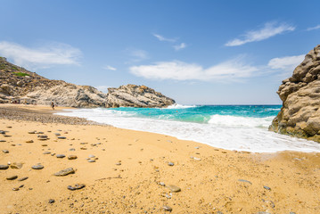 Beautiful sunny cozy holiday bay with big waves with crystal clear blue water sandy beach and a small laguna for sunbathing swimming or surfing, Ikaria Island, Nas Beach, Samos, Sporades, Greece