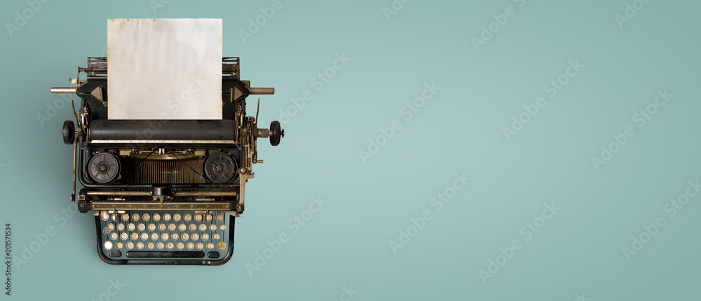 Vintage typewriter header with old paper. retro machine technology - top view and creative flat lay design. - obrazy, fototapety, plakaty 