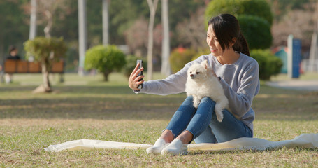 Sticker - Woman taking selfie by mobile phone with her dog