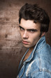 © Bakulov - Closeup portrait of a young man. Casual style, blue Jean jacket.